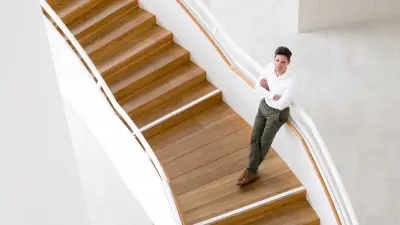 Blockchain expert Nik Scharmann on a staircase.