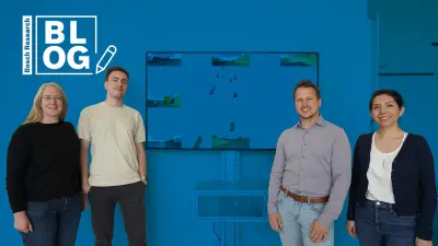 The four Bosch Research experts (from left), Nina Bretz, Michael Beyer, Christoph Schorn and Cecilia De La Parra in front of a monitor displaying a visualization of a neural network's prediction for an Advanced Driver Assistance System (ADAS).