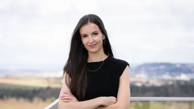 Research engineer Mirjam Henn discusses her work on wide bandgap semiconductors for e-mobility, she is standing at the balcony of the Bosch Research building in Renningen, Germany.