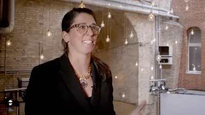 Erin Baumgartner giving a speech at the Bosch IoT conference