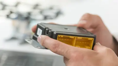 Marcus Parentis holds a Bosch MEMS sensor box is his hands.
