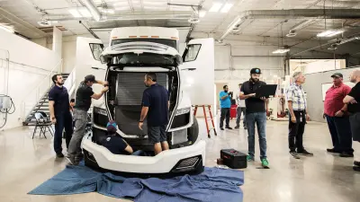Bosch engineers apply the finishing touches to the Nikola Two truck.