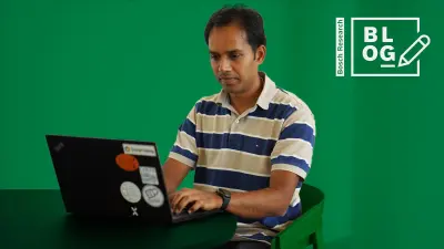 Bosch Research R&D Project Lead for Fuzzing Rakshith Amarnath sitting at a table in front of his notebook at the Bosch Research Campus in Renningen, Germany