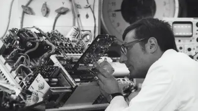 Testing power electronics for electric vehicles (1967). At that time, the electronics for electrically-powered automobiles still took up much of the trunk space.
