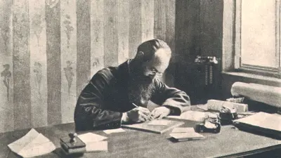 Robert Bosch sitting at a desk writing