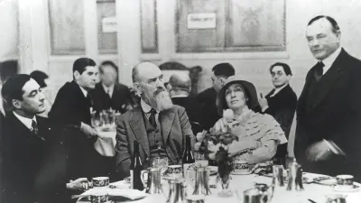 Robert Bosch with several people at a laid table