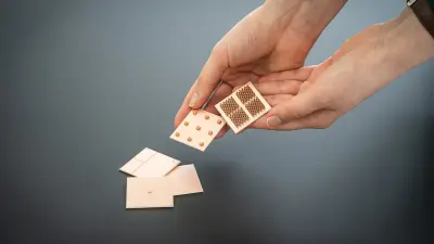 Bosch Research PhD candidate Isabelle Günther showing various functional structures for power electronics, additively manufactured out of copper on ceramic-based substrates.