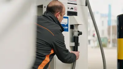 The truck driver Jean-Marie refuels his truck at a hydrogen pump.
