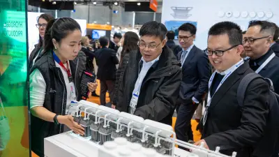 People at an exhibition booth.