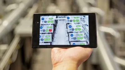A smartphone monitoring industry 4.0 processes.