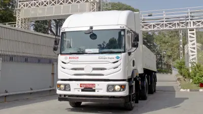 A large white commercial truck, prominently displaying "BOSCH" and "Hydrogen Engine" branding on its front grille, parked at the Bosch test track in Bengaluru.