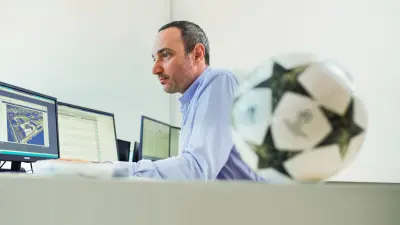 Bosch IT engineer Massimo Rosta is sitting at his computer.