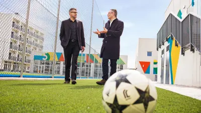 Angelo Paisio and Alberto Bollea in the courtyard of the international school
