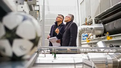 Alberto Bollea and Angelo Paisio deep inside the mechanical room in Turin