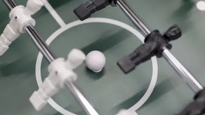 Black and white figures from a table soccer