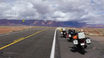 Three motorcycles parked on Route 66.