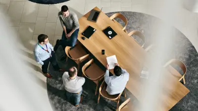 A bird’s-eye view of a team at a conference table.