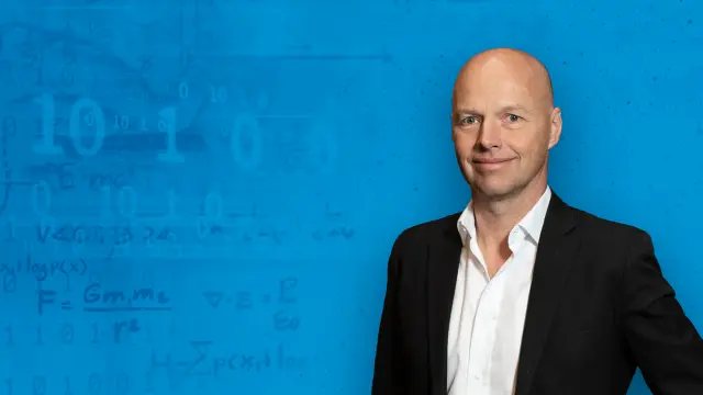 Sebastian Thrun against a blue background.