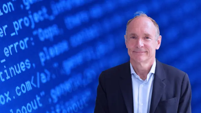 Tim Berners-Lee in front of a blue wallpaper.