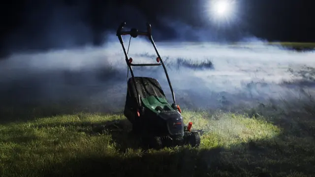 The Bosch UniversalRotak takes center stage, staged in a nocturnal meadow with a light foggy atmosphere and a radiant light in the background.