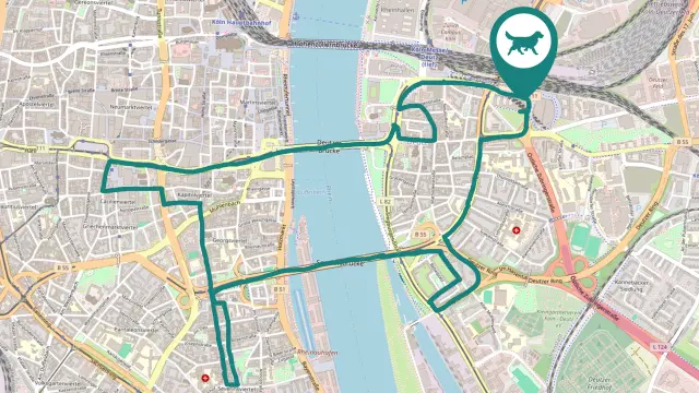 A city map shows a GPS route that represents the shape of a dog. The route runs through various districts and over a bridge, with a symbol with a dog highlighting the start and finish positions.