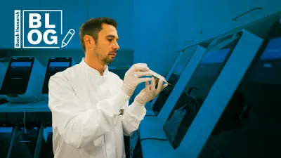 Bosch Researcher Christian Grumaz during his work with Vivalytic: a universal platform for molecular diagnostics from Bosch Healthcare Solutions developed by Bosch Research.