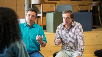 Andre Kretschmann and Tino Fuchs in conversation during the interview.