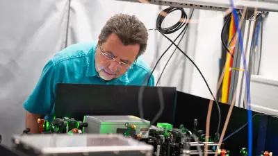 Andre leaning over the NV magnetometers