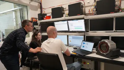 The team is watching the AI evaluating news measuring data in real time.