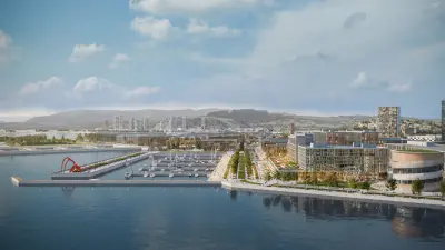 Moderne Stadt am Meer mit Yachthafen.