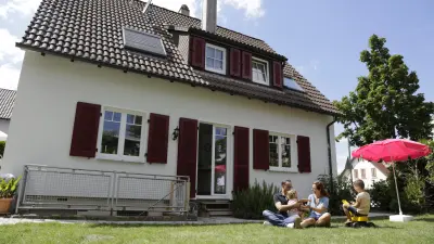 The image shows a family in their backyard.