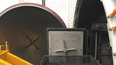 Loading a single crankshaft into a single chamber furnace at the Bosch Research Center in Renningen for verifying simulation results 