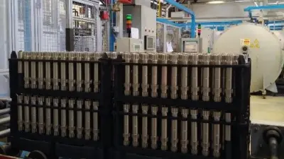Batch build-up in series production in front of the multi-chamber furnace at the at the Bosch plant in Bari, Italy, e.g. shaft components