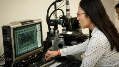 Student at Bosch Research and Technology Center in front of a computer
