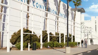 Michael Johnson and Jeff Bartel walk outside the Ontario Convention Center.