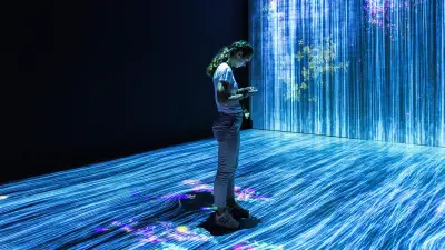 A woman standing in a stream shining with blue light, which symbolizes data. 