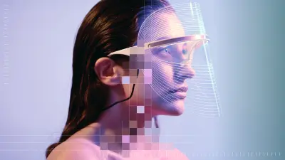 A person wearing a futuristic headset looks ahead. Parts of the image are overlaid with colorful pixel blocks.