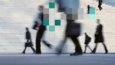People walk through an urban area past a large staircase. Parts of the image are overlaid with colorful pixel blocks.