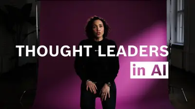 Nicole Büttner sits on a chair and speaks into the camera.