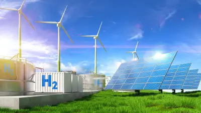 Digital erzeugtes Bild von Windturbinen, Solarzellen und Wasserstoffbehältern in der Landschaft vor blauem Himmel.