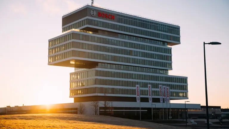 Multi-storey Bosch office building with glass facade and Bosch logo