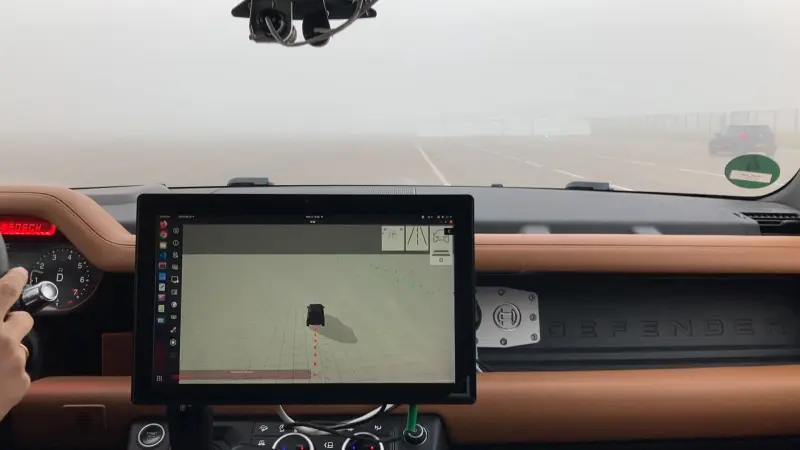 Interior of a car with a dashboard screen showing a 3D vehicle model.