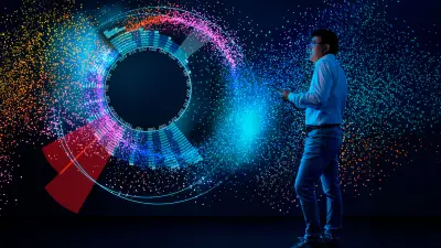 Liu Ren is standing in front of a display that shows a data analysis. The data is visualized by visual analytics in such a way that allows people to spot errors immediately.