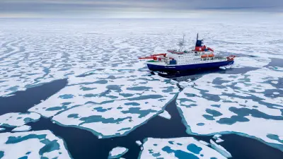 The research vessel Polarstern in the midst of ice floes.