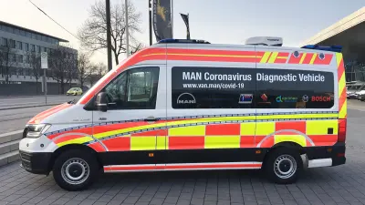 A diagnostic vehicle from MAN from the side in a car park.