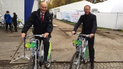 Bernhard Schwager and Urs Ruth on bicycles