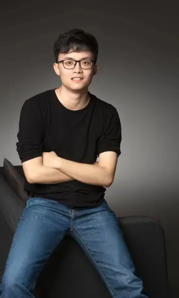 Wu Heng lächelt in die Kamera.